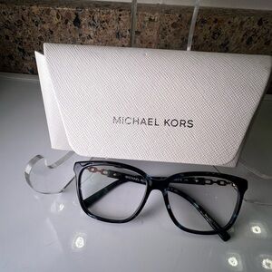 Michael Kors women’s preowned, marbled blue eyeglasses with a white case